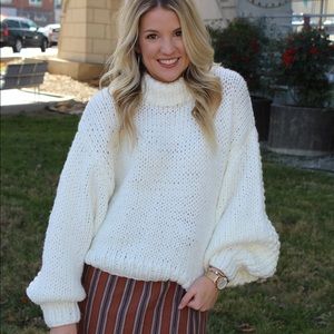 White puffy sweater knitted